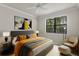 A cozy bedroom featuring stylish decor and a large window with scenic views at 224 S Audubon Ave, Tampa, FL 33609