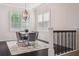 Elegant dining room with modern lighting, and comfortable seating for six at 224 S Audubon Ave, Tampa, FL 33609