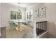 Dining room with modern furnishings, natural light, decorative chandelier, and neutral decor at 224 S Audubon Ave, Tampa, FL 33609