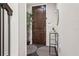 Stylish entryway featuring a dark wood front door and a decorative rug at 224 S Audubon Ave, Tampa, FL 33609