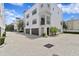 Stunning three-story home with a two-car garage and beautiful architectural details at 224 S Audubon Ave, Tampa, FL 33609