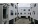 A courtyard view features modern townhomes with garages and manicured greenery at 224 S Audubon Ave, Tampa, FL 33609