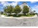Well-maintained exterior with mature trees and manicured landscaping at 224 S Audubon Ave, Tampa, FL 33609