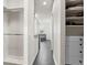 Hallway leading to bathroom with tile flooring, closet, and shower at 224 S Audubon Ave, Tampa, FL 33609
