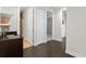 Hallway space with hardwood floors, featuring a wet bar and multiple entrances at 224 S Audubon Ave, Tampa, FL 33609
