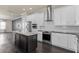 Well-equipped kitchen showcases stainless steel appliances, a center island, and sleek cabinetry at 224 S Audubon Ave, Tampa, FL 33609