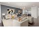 Spacious living room with modern decor, stylish furnishings, a decorative chandelier, and an open floor plan at 224 S Audubon Ave, Tampa, FL 33609
