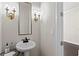 Stylish powder room with elegant lighting and modern fixtures at 224 S Audubon Ave, Tampa, FL 33609