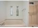 Bathroom featuring stained glass windows and bathtub at 238 Pelican N Dr, Oldsmar, FL 34677