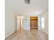 Bedroom with walk-in closet and light wood-look flooring at 238 Pelican N Dr, Oldsmar, FL 34677