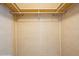A simple walk-in closet space with installed hanging rods at 238 Pelican N Dr, Oldsmar, FL 34677