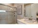 Elegant bathroom featuring a glass door shower, marble countertop vanity, and neutral color scheme at 29508 Zupetta Ln, Wesley Chapel, FL 33543