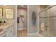 Modern bathroom with glass-enclosed shower and walk in closet at 29508 Zupetta Ln, Wesley Chapel, FL 33543