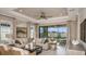 Bright and airy living room with sliding glass doors and comfortable seating arrangement at 29548 Zupetta Ln, Wesley Chapel, FL 33543