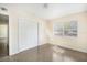 An empty bedroom with closet doors and natural lighting at 3005 E Sligh Ave, Tampa, FL 33610