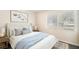 Bright bedroom features a large window, plush carpet, and cozy bed with stylish bedding at 3005 E Sligh Ave, Tampa, FL 33610
