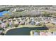 Aerial view of a residential neighborhood featuring lush landscaping, bodies of water, and manicured lawns at 3033 Marble Crest Dr, Land O Lakes, FL 34638