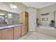Bright bathroom with a vanity, shower and bathtub combination, providing comfort and convenience at 3033 Marble Crest Dr, Land O Lakes, FL 34638