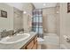 Bright bathroom featuring a ceramic tile surround tub, wood cabinets and neutral paint at 3033 Marble Crest Dr, Land O Lakes, FL 34638