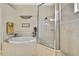 Nicely styled bathroom featuring a large soaking tub and glass enclosed walk-in shower at 3033 Marble Crest Dr, Land O Lakes, FL 34638
