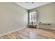 Neutral bedroom with light wood flooring and ample natural light, creating a versatile space at 3033 Marble Crest Dr, Land O Lakes, FL 34638