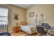 Bedroom with wood floors, colorful artwork, and desk/keyboard at 3033 Marble Crest Dr, Land O Lakes, FL 34638