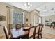 Elegant dining room with large windows and stylish furnishings at 3033 Marble Crest Dr, Land O Lakes, FL 34638