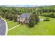 Luxurious stone clubhouse boasting meticulously manicured lawns and scenic views of the pool and lake at 3033 Marble Crest Dr, Land O Lakes, FL 34638
