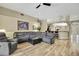 Spacious living room features hardwood floors, open layout and plenty of seating at 3033 Marble Crest Dr, Land O Lakes, FL 34638