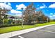 Community playground featuring a covered play area and lush greenery, providing a safe and fun environment at 3033 Marble Crest Dr, Land O Lakes, FL 34638