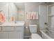 Clean bathroom with a single vanity, bathtub/shower combo, and ample lighting at 30903 Quail Caper Cir, San Antonio, FL 33576