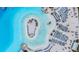 Overhead shot displays the beach club amenities including chairs, umbrellas, and recreational areas at 30903 Quail Caper Cir, San Antonio, FL 33576