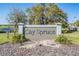 Cay Spruce community entrance sign with meticulous landscaping in a beautiful setting at 30903 Quail Caper Cir, San Antonio, FL 33576