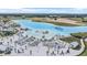 Scenic aerial showcases the lagoon and its sandy lounge area perfect for the Florida lifestyle at 30903 Quail Caper Cir, San Antonio, FL 33576