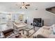 Spacious living room featuring plush furnishings, and tile flooring at 30903 Quail Caper Cir, San Antonio, FL 33576