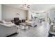 Bright and open living room with an adjacent kitchen, perfect for entertaining guests at 30903 Quail Caper Cir, San Antonio, FL 33576