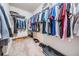 Spacious walk-in closet with ample storage, shelving, and rod space for organization at 30903 Quail Caper Cir, San Antonio, FL 33576