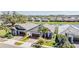 An aerial view showing homes, community, and the lake at 31616 Parkland Bay Way, San Antonio, FL 33576
