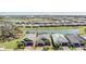 Aerial view of single Gathering homes, a lake, and lots of mature trees in a well manicured neighborhood at 31616 Parkland Bay Way, San Antonio, FL 33576