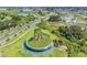 An aerial shot of a Primary-planned community, highlighting the green spaces, water features, and landscaping at 31616 Parkland Bay Way, San Antonio, FL 33576