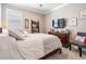 Cozy bedroom featuring a neutral color scheme, a comfortable bed, and ample natural light at 31616 Parkland Bay Way, San Antonio, FL 33576