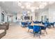 Clubhouse interior features a modern design with a bar, ample seating, and contemporary lighting fixtures at 31616 Parkland Bay Way, San Antonio, FL 33576