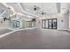 Spacious fitness studio with mirrored walls, fans, and versatile space for exercise, yoga or dance at 31616 Parkland Bay Way, San Antonio, FL 33576