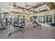 Bright gym with various weight and cardio machines, complemented by natural light from outdoor view at 31616 Parkland Bay Way, San Antonio, FL 33576