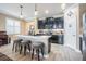 Modern kitchen with stainless steel appliances and an island with countertop seating at 31616 Parkland Bay Way, San Antonio, FL 33576