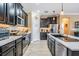 Well-equipped kitchen featuring stainless steel appliances, a center island, and dark cabinets at 31616 Parkland Bay Way, San Antonio, FL 33576