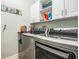 Convenient laundry room with modern appliances, ample counter space, and storage cabinets at 31616 Parkland Bay Way, San Antonio, FL 33576