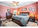 Spacious main bedroom featuring hardwood floors and a ceiling fan at 31616 Parkland Bay Way, San Antonio, FL 33576