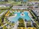 Aerial view of the resort-style pool with palm trees, cabanas, and plenty of space to relax at 31616 Parkland Bay Way, San Antonio, FL 33576