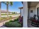 Cozy porch features decorative plants, rocking chairs, and a view of the lake at 31616 Parkland Bay Way, San Antonio, FL 33576